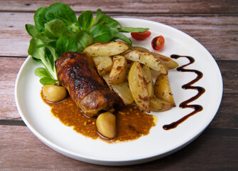 Recipe for boneless rolled chicken leg with potatoes and molasses-flavoured mache salad, High quality photo