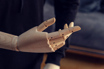 Wooden dummy hand. Telling gesture. Good talk. indirect explanation.