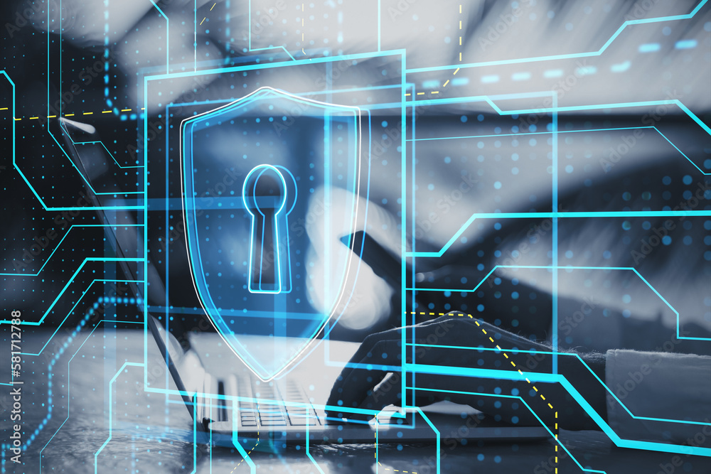 Poster close up of male hands using cellphone and laptop on desktop with glowing safety and security circui