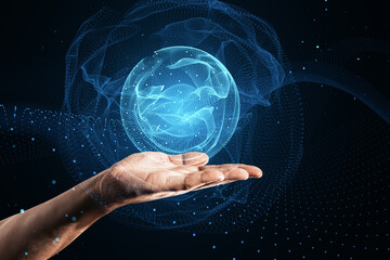 Close up of male hand using polygonal globe hologram on dark background. World map with global...