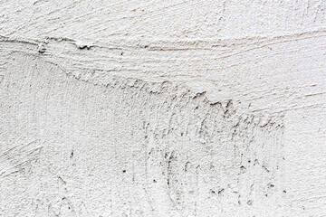 white concrete wall background with grainy details. high detailed closeup view.