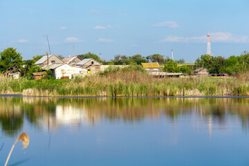 View of the village pond and houses on the shore