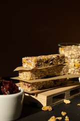 Homemade natural Granola energy bar. Variety of homemade Protein granola breakfast bars ingredients nuts, raisins dried cherries and chocolate. Healthy nutrition eating. Gluten free cereal dieting