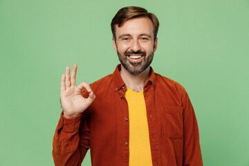 Elderly smiling happy fun satisfied positive caucasian man 40s years old wears casual clothes red...