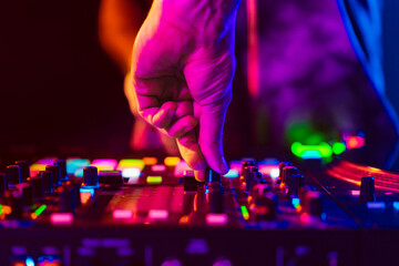 Close up of dj console mixer during concert in the club