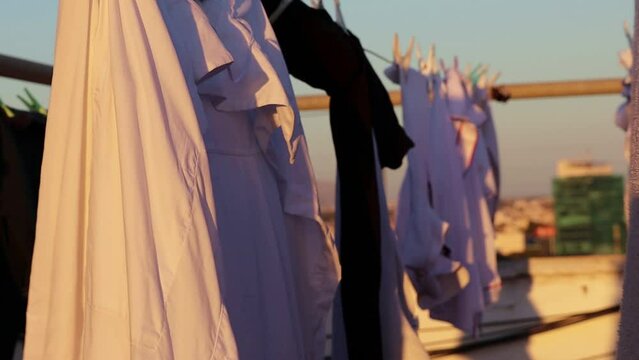Hanging clothes drying in the air on a rooftop