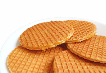 Closeup of Mouthwatering Stroopwafels, a Traditional Dutch Waffles on White Background