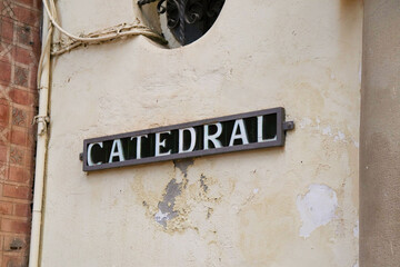 A Sign outside Granada Cathedral that says "Cathedral" in local Spanish Language
