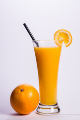 ice cold chilled fresh orange fruit juice in tall glass on white background beverage drink halal menu