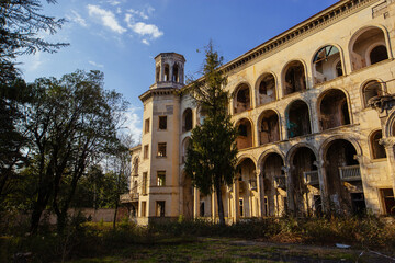Fototapeta na wymiar Ruined overgrown old abandoned Soviet sanatorium Iberia, Tskaltubo, Georgia
