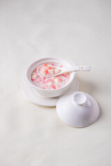 traditional ice cold chilled colourful fruit peach gum bo bo cha cha sweet soya bean coconut milk soup in white bowl on wood background sweet dessert halal menu