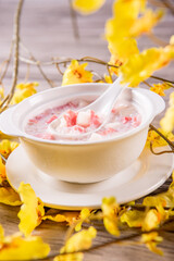 traditional ice cold chilled colourful fruit peach gum bo bo cha cha sweet soya bean coconut milk soup in white bowl on wood background sweet dessert halal menu