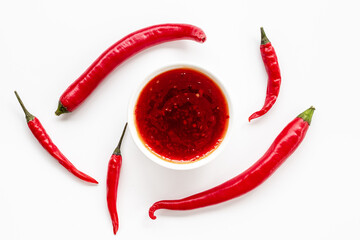 Spicy seasoning - red chili pepper and sauce, top view