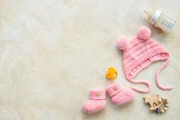 Baby infant hat with booties and kids accessories, flat lay