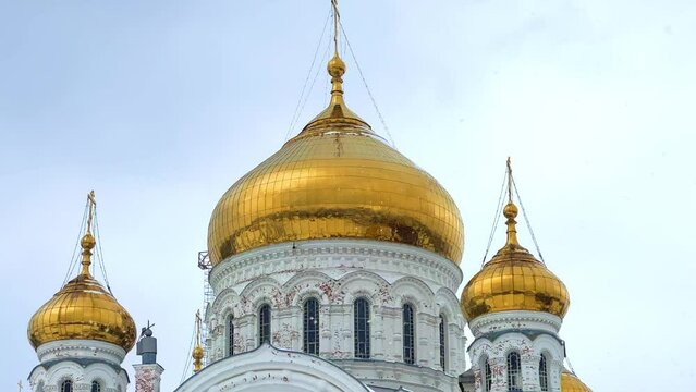 Belogorsky St. Nicholas Orthodox Missionary Monastery. Russia, Perm Krai, Belaya Gora. The temple on the hill in winter. Monastery on the background of snow. 4K