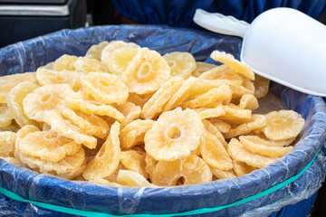  Dried sweet pineapples closeup, texture. Food background. Candied fruits background. Organic food. Street food
