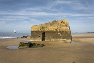 World War 2 bunker (The Atlantic Wall) on a French beach (la Grande Côte) at Saint-Palais-sur-Mer. There are graffiti and carved inscriptions on the blockhaus walls.