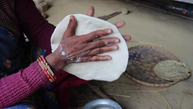 women making rice bread in traditional way from different angle at village