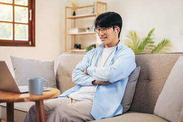 Businessman in casual is sitting with arm crossed on comfortable