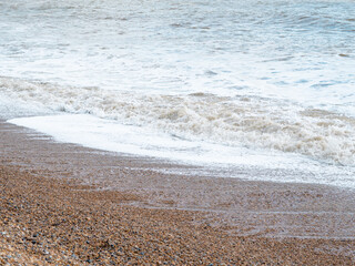 blue sea with waves and sandy shore ,beautiful natural seascape