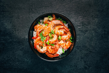 close-up of rice with fried shrimp on a black background