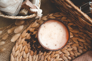 Body scrub from ground coffee and sugar in a jar on the background of cosmetic care products, home...