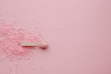 aromatic pink Himalayan sea salt on pink background. Homemade Herbal bath salts. Skincare spa...