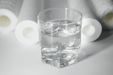 filter cartridges for water on a white background. Installation of reverse osmosis water purification system.