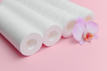 filter cartridges for water on a pink background. Installation of reverse osmosis water purification system.