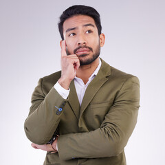 Business man, thinking and planning in studio with ideas or strategy on gray background. Asian male...