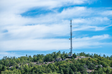 Teleconnunications mast on top of a cliff.