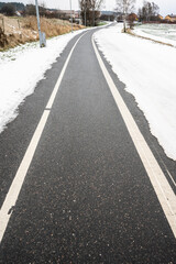 Bicycle lane having been cleared of snow.