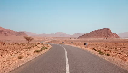 Papier Peint photo Lavable Maroc Asphalt road in desert landscape in Morocco- Travel,  safari, extreme adventure in Africa