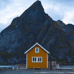 A small building in front of a mountain Norway Lofotten Hamnoy