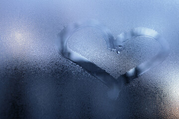 heart painted on the misted glass window