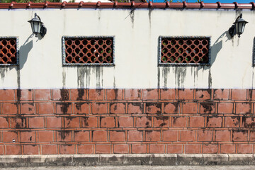 Chinese red brick walls with lattice windows