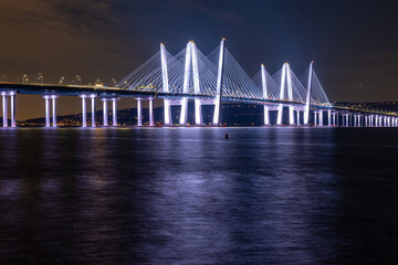 Night photo of the Governor Mario M. Cuomo Bridge, spanning the Hudson River between Tarrytown and Nyack - obrazy, fototapety, plakaty