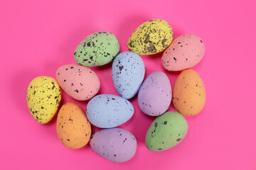 decorative easter eggs on pink background