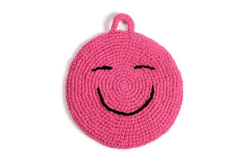 Pink handmade crochet pot holder with a smile