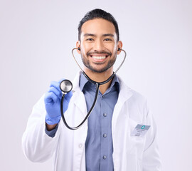 Medical doctor, portrait man or stethoscope for support on healthcare, nurse work or clinic cardiology. Wellness service, studio or happy person with heart beat listening equipment on gray background