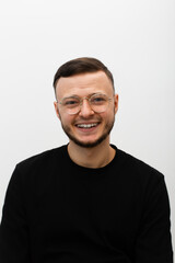 young man in glasses expressing smiling emotions, smile