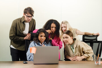 Fototapeta premium worried business man and woman colleagues looking at computer trying to solve problems in office