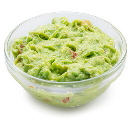 Glass bowl of guacamole on white background. File contains clipping path.