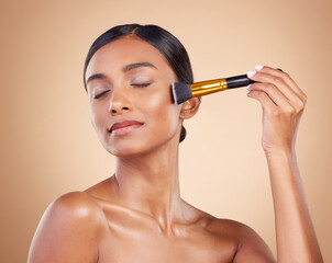 Woman, brush or makeup artist with beauty, cosmetic products or self care in studio background....