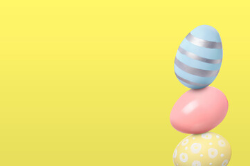 Stack of Easter eggs on light yellow background, space for text