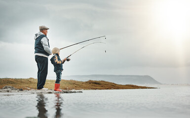 Lake, nature and grandfather fishing with a child learning on an adventure, holiday or weekend trip. Hobby, outdoor and elderly man teaching kid to catch fish on a vacation by a river with mockup