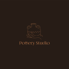 Pottery Studio Logo. Hand drawn pot on the hand on the dark background.