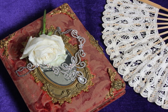 White Rose on Antique Book With Crystal Rhinestone Necklace