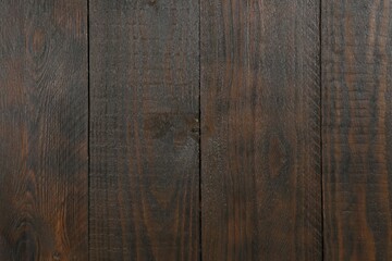 Obraz premium Texture of dark brown wooden surface as background, closeup