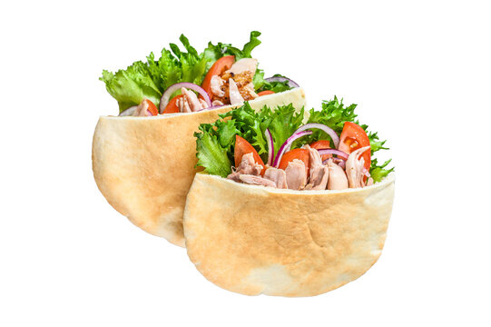 Doner kebab with grilled chicken meat and vegetables in pita bread.  Isolated, transparent background.